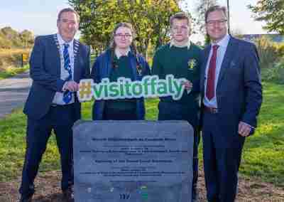 TD James Lawless opening the grand canal greenway with locals and them holding a Visitoffaly sign