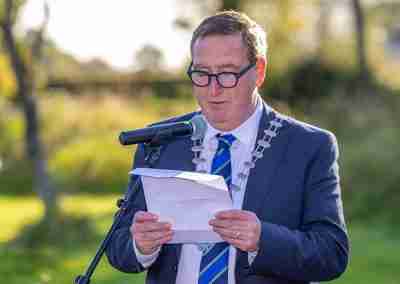 Cathaoirleach of offaly county council reading a speek from a sheet of paper